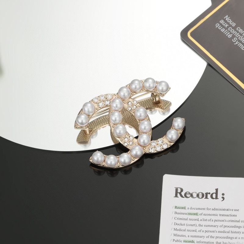 Ch*el brooches